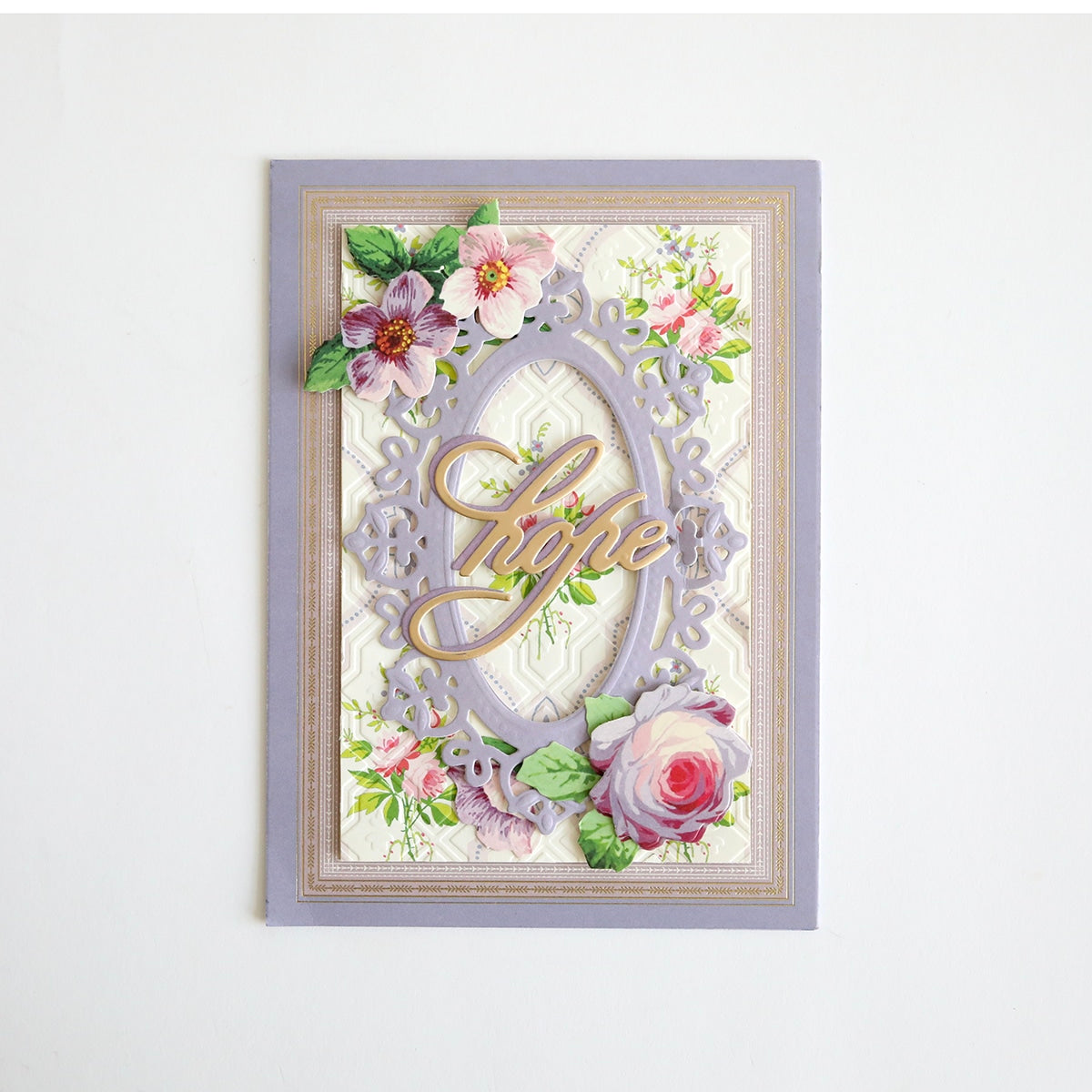 A card with flowers and a heart on it.