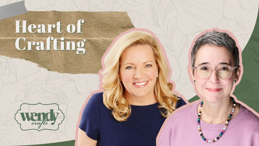 Two women smiling in front of a textured background with the text "Heart of Crafting" and the logo "wendy crafts" visible.