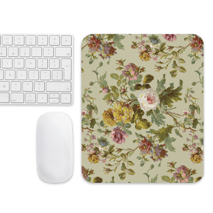 A keyboard and mouse are accompanied by the Mouse Pad, featuring roses and leaves on a light backdrop for supreme grip and smooth movement.