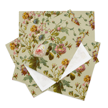 The Placemat Set of 4 showcases a vintage botanical design with floral patterns of roses and leaves, creatively reimagined from paper into unique, stylish placemats that are perfect for customizable dining decor and are water-resistant.