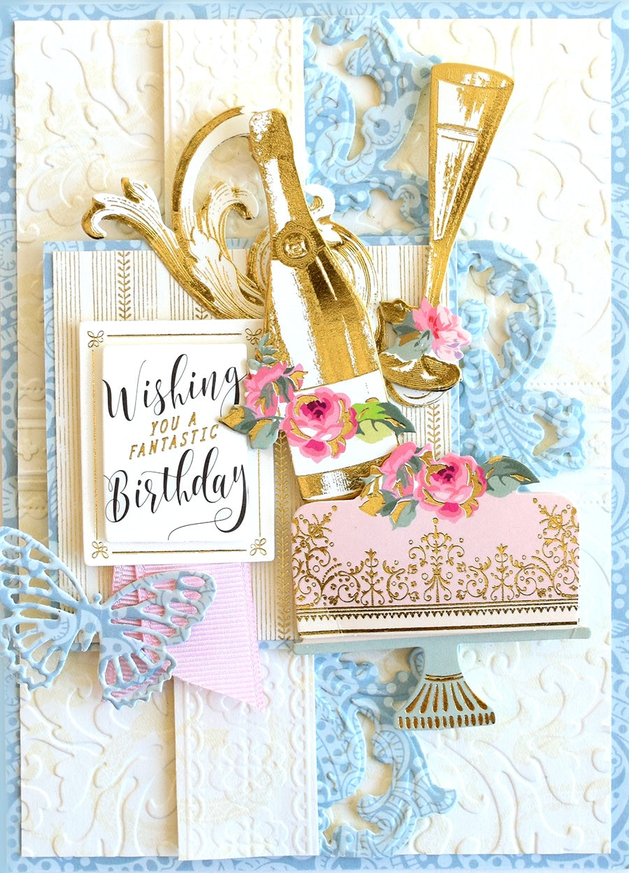 a birthday card with a gold shoe and pink flowers.