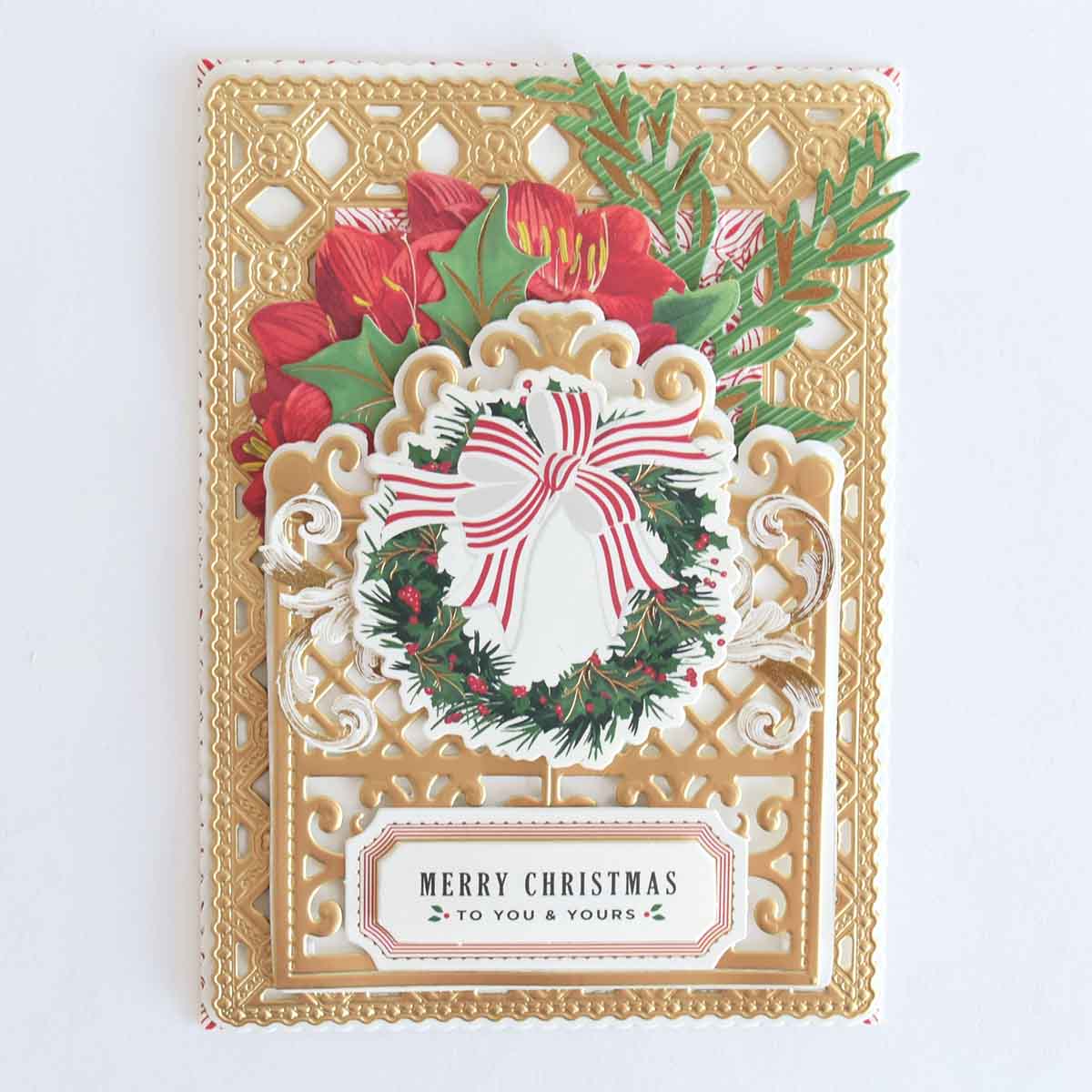 a christmas card with a wreath and a bow.