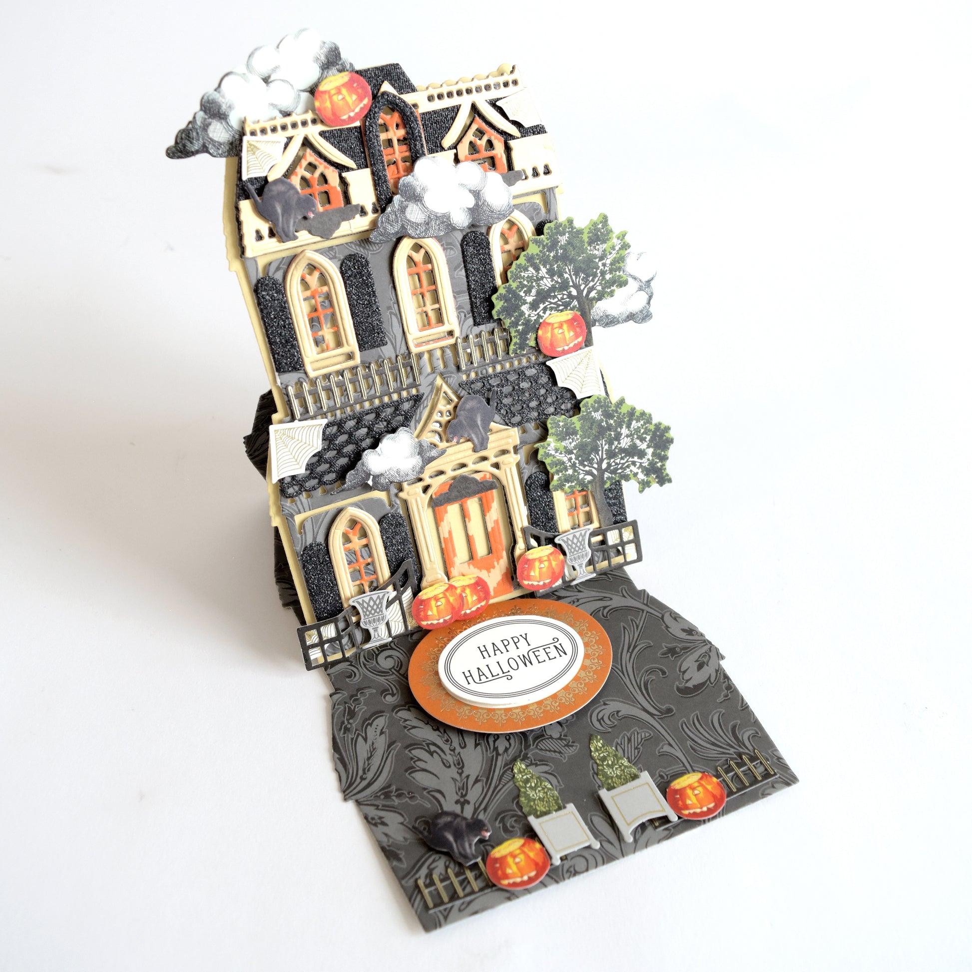 a halloween card with a castle on it.