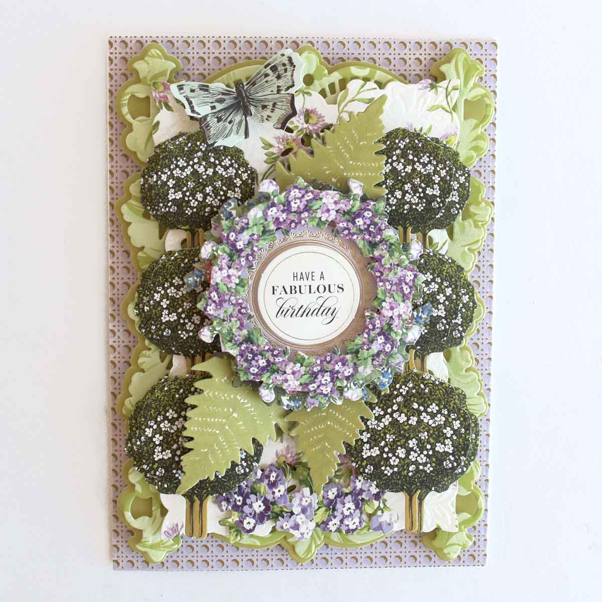 a close up of a card with a wreath.