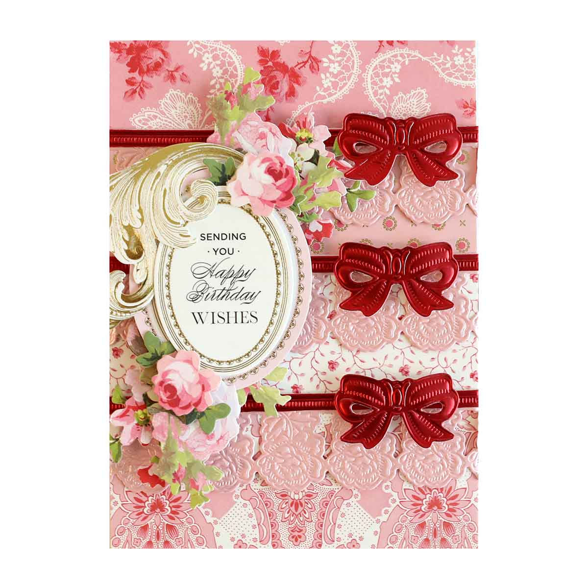 a pink card with red bows and flowers.