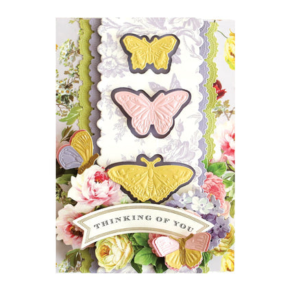 a card with butterflies and flowers on it.