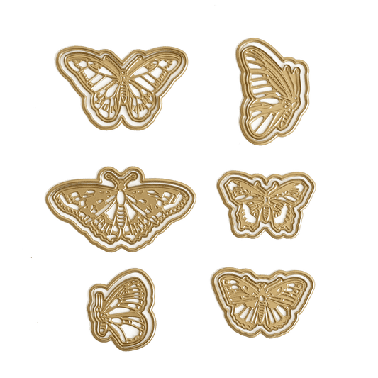 a set of four butterflies on a green background.