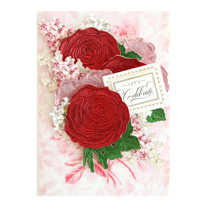 a close up of two flowers on a card.