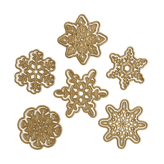 a set of four snowflakes on a green background.