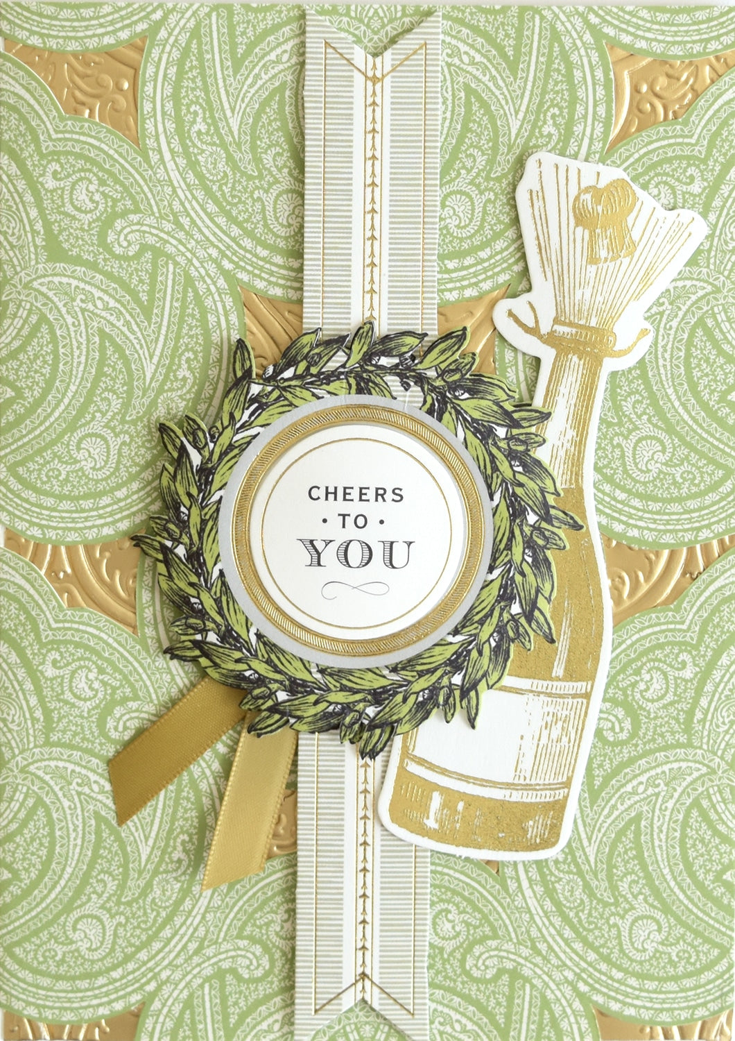 a close up of a card with a wreath on it.