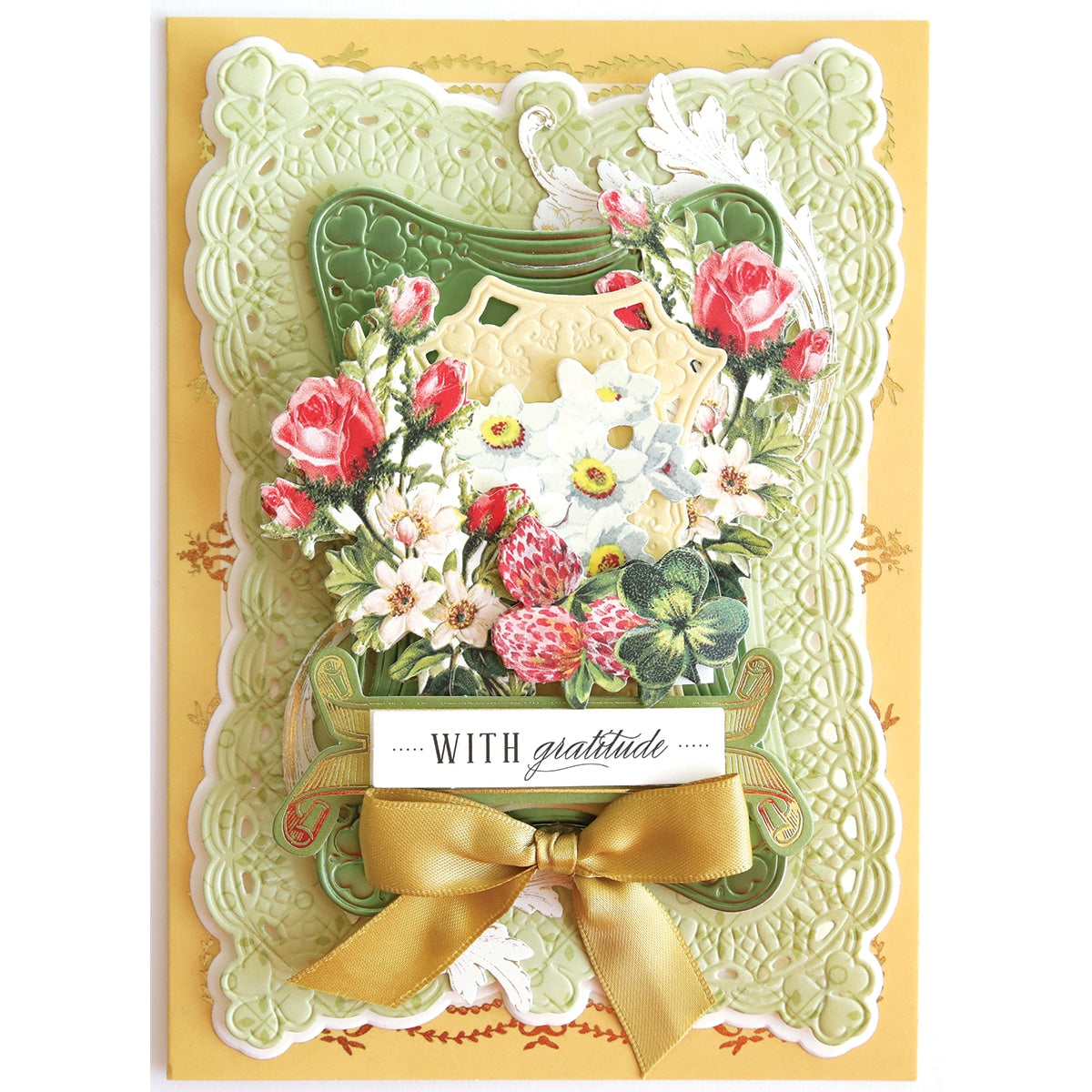 a card with flowers and a bow on it.