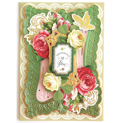 a card with flowers and lace on it.
