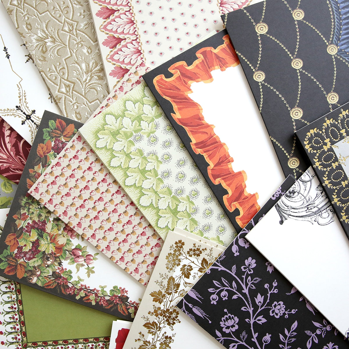 A bunch of Fall Pattern Cards and Envelopes with different designs on them.