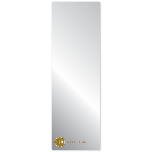 a mirror with a gold emblem on it.