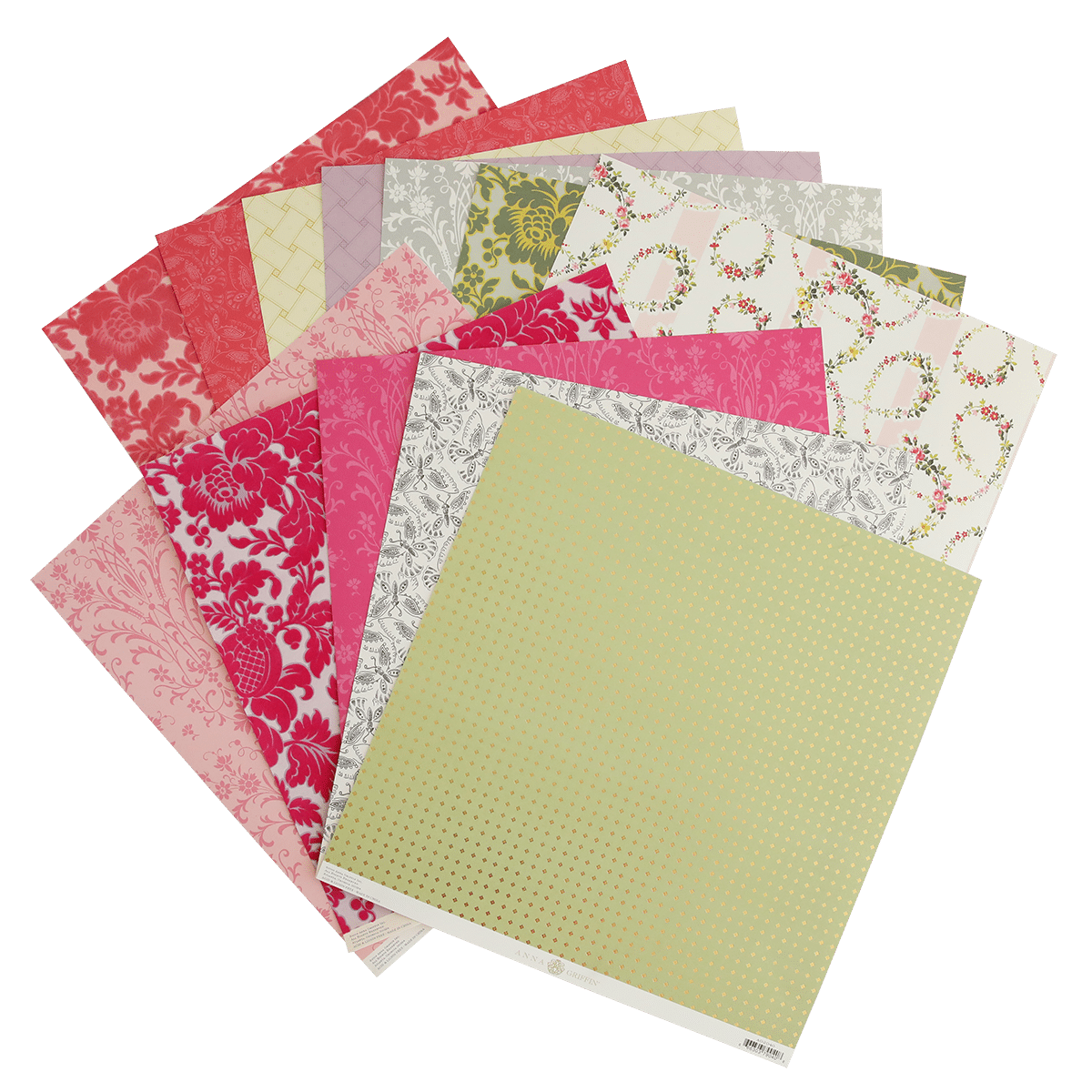 A pile of Grace 12x12 Cardstock papers on a white surface.