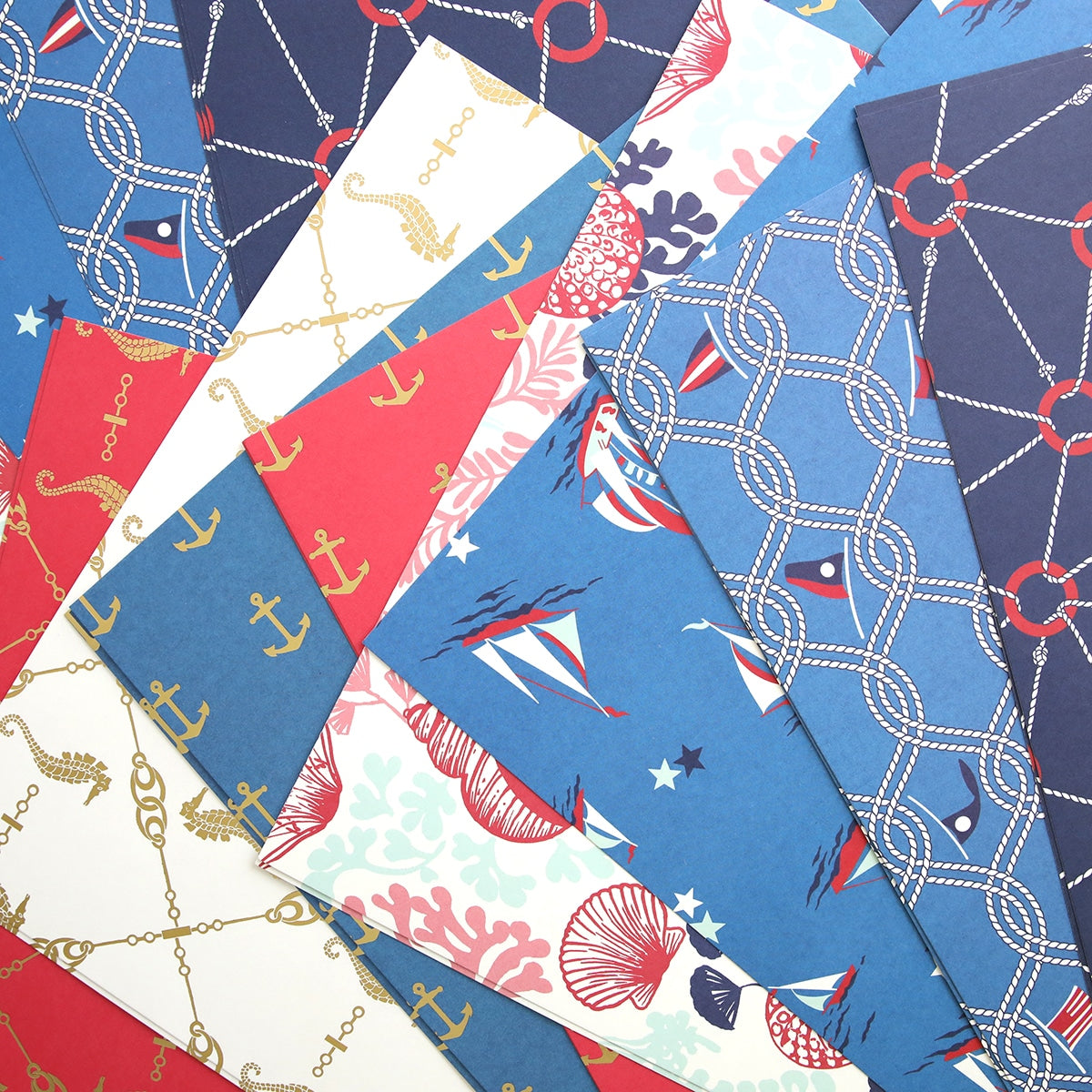 A close up of many different Seafarer 12x12 Papers and Cardstocks.