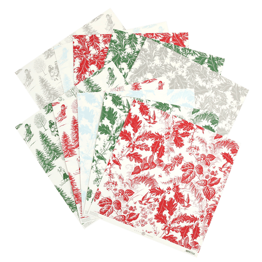 a stack of Christmas Toile 12x12 Cardstock papers with red, green and white designs.