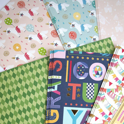 A collection of Birthday 12x12 Cardstock with different designs on them.