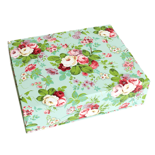 a green box with pink and white flowers on it.