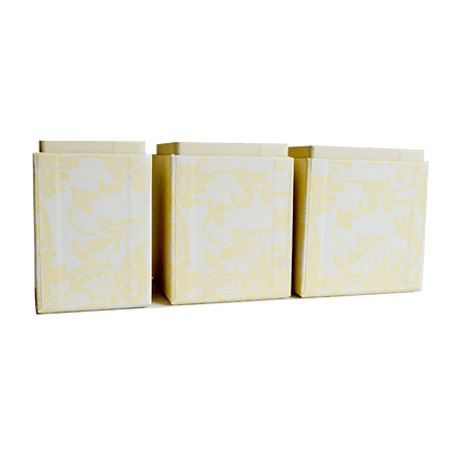 a set of three yellow and white paper bags.
