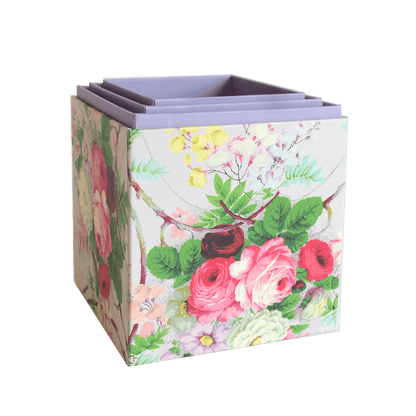 a flowered box is shown on a green background.