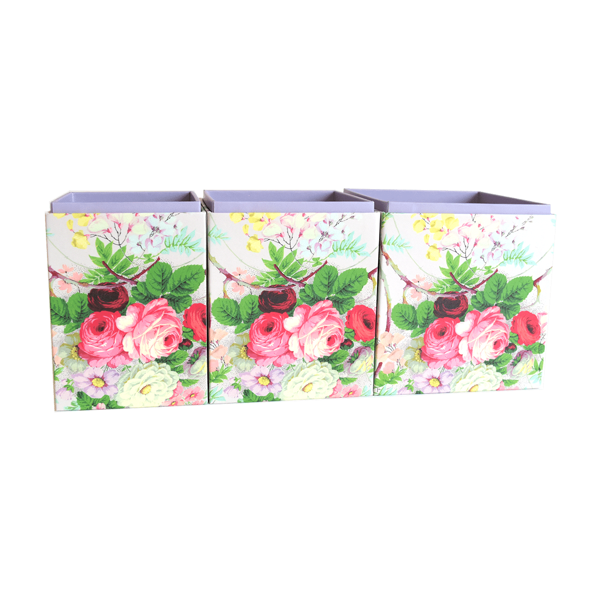 three boxes with flowers painted on them.