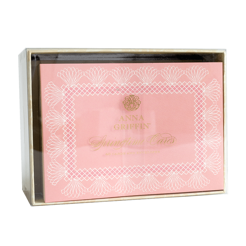 a pink and white box with a label on it.