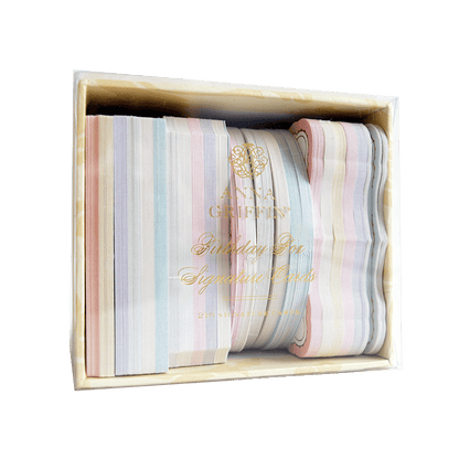 a set of five striped napkins in a wooden box.