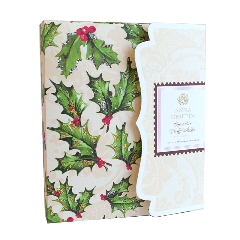 a christmas card with holly leaves and berries.
