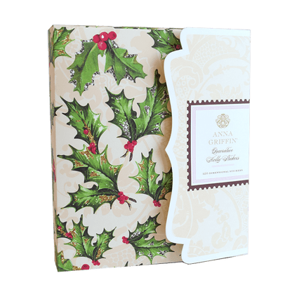 a christmas card with holly leaves and berries.