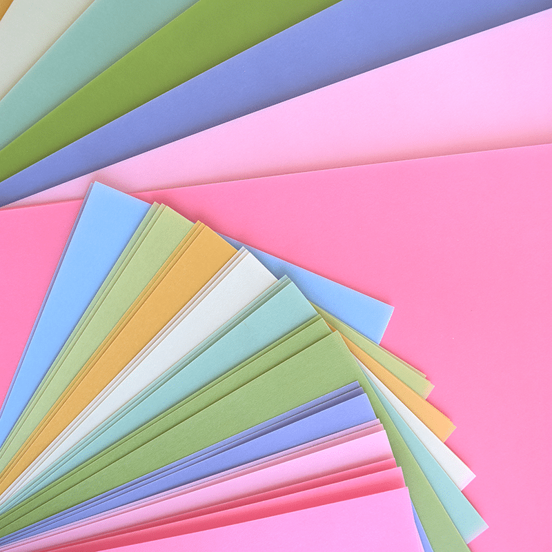 a close up of many different colors of paper.