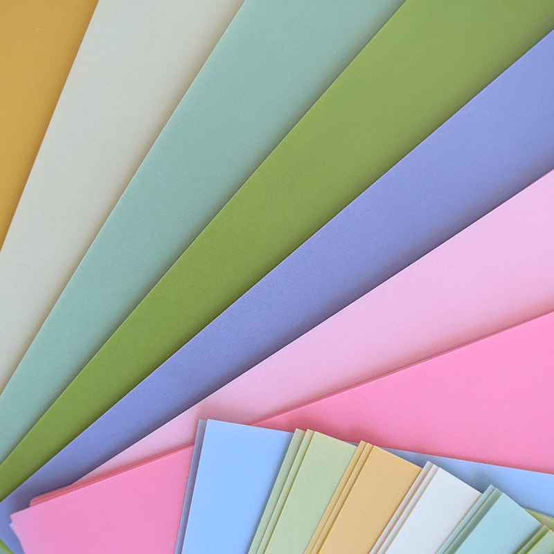 a close up of many different colors of paper.