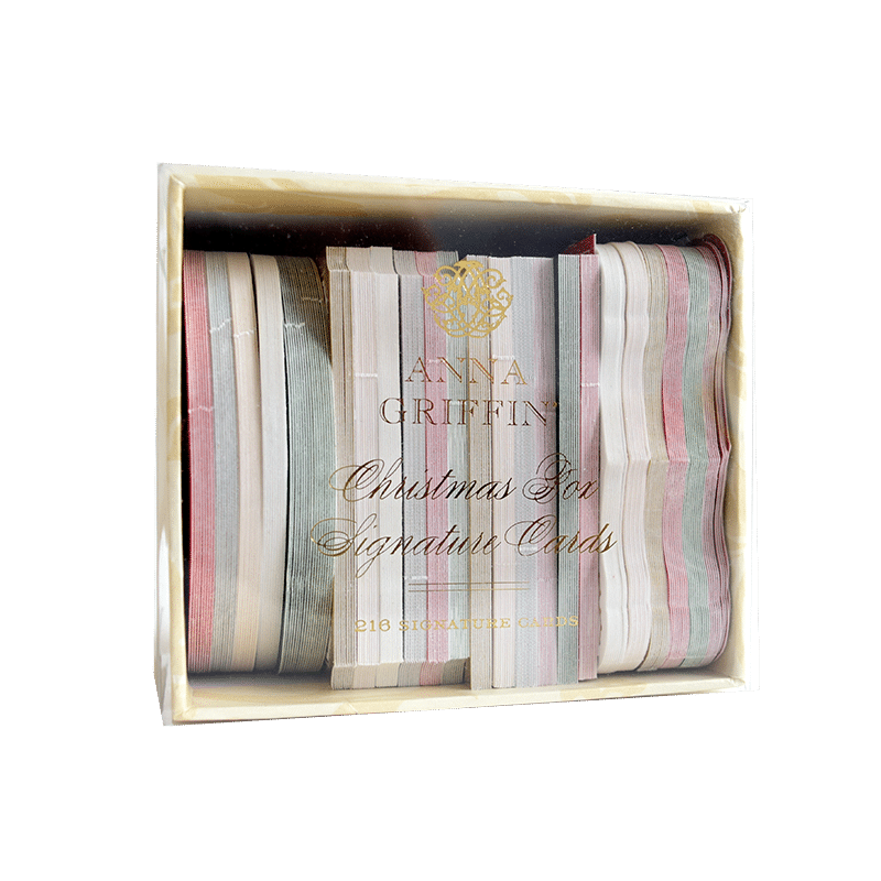 a wooden box filled with different colored ribbons.
