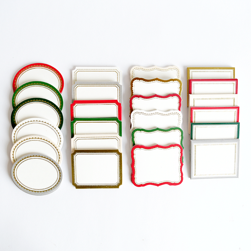 a white table topped with lots of plates and place settings.