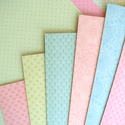 a close up of many different colored papers.