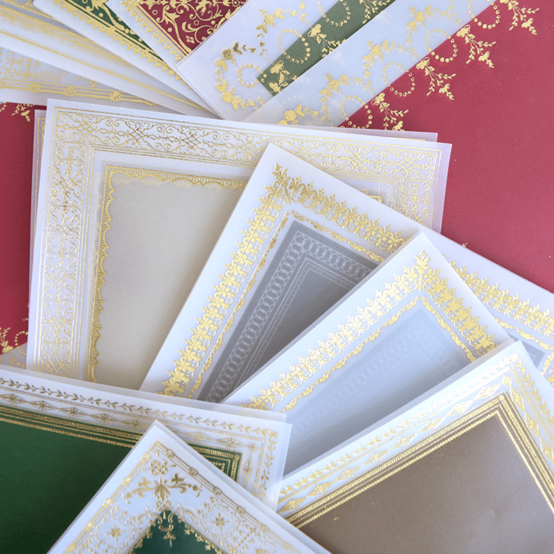 a pile of different colored and white frames.
