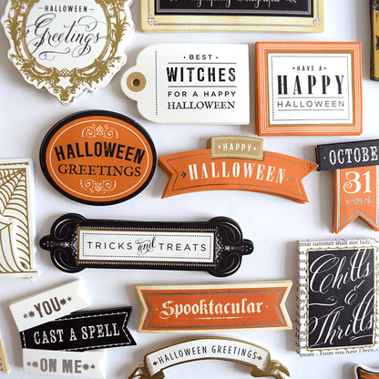 a collection of halloween stickers on a white surface.