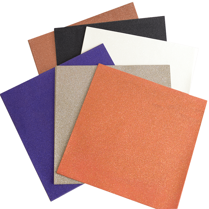 a pile of different colored paper on a white background.