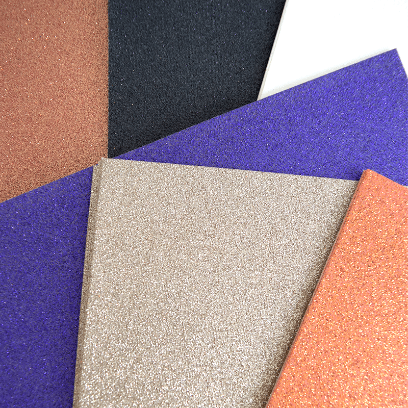 a variety of different colors of glitter paper.