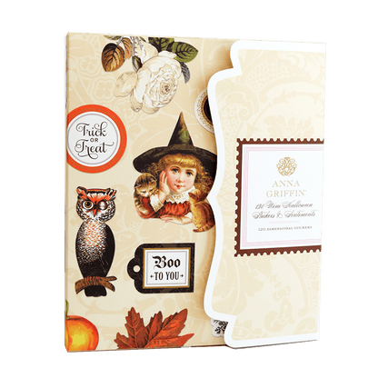 a card with a picture of an owl and a witch on it.
