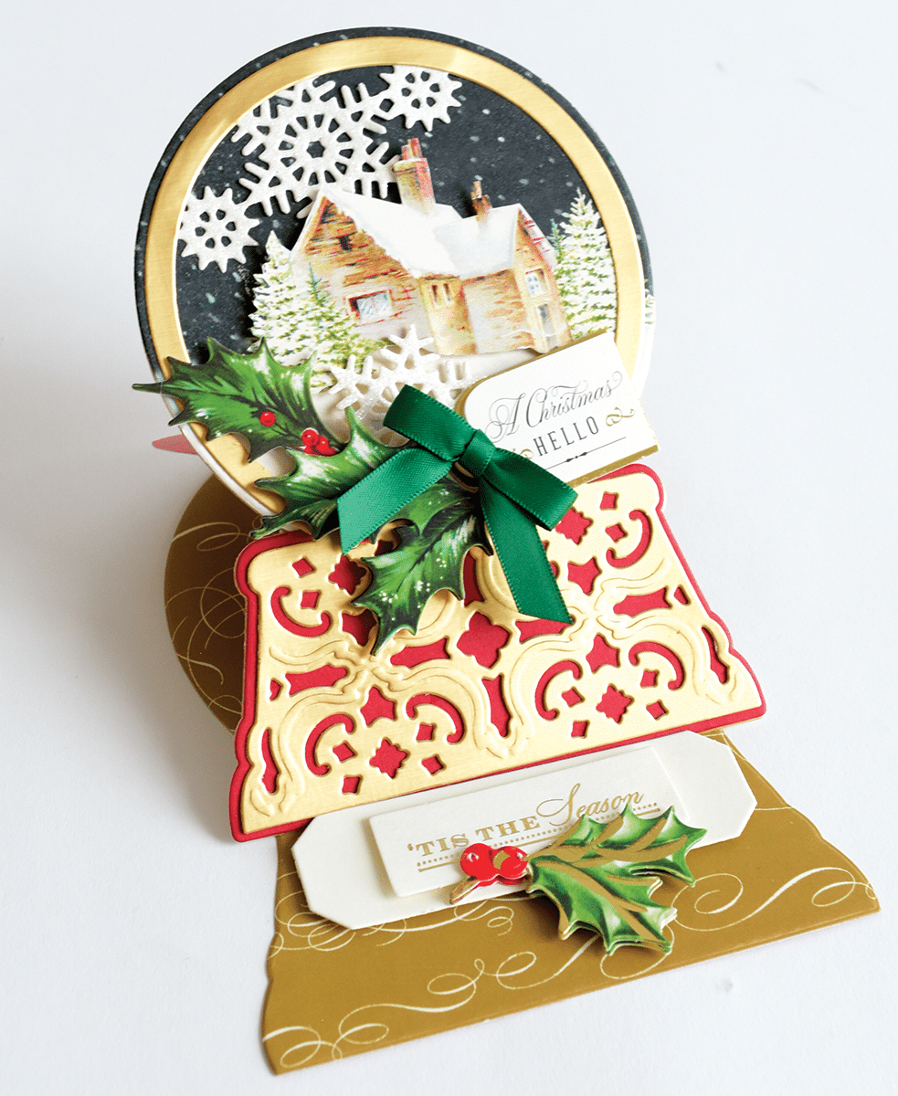 a close up of a christmas card with a house.