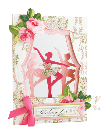 a card with a picture of a ballerina and a pink ribbon.