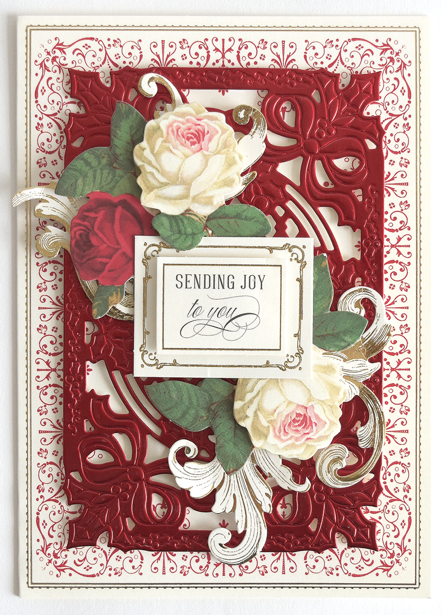 a red and white card with roses on it.