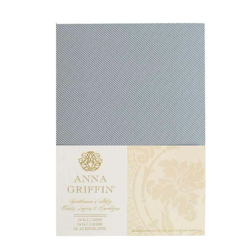 a blue and white napkin with a gold emblem on it.