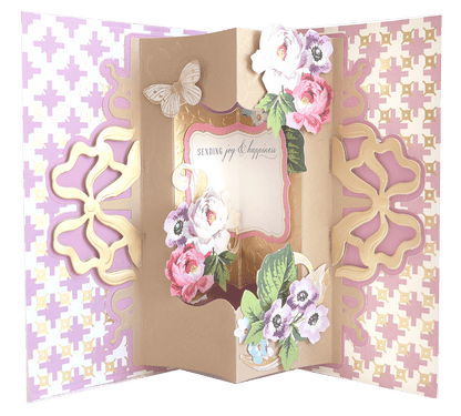 an open card with flowers and butterflies on it.
