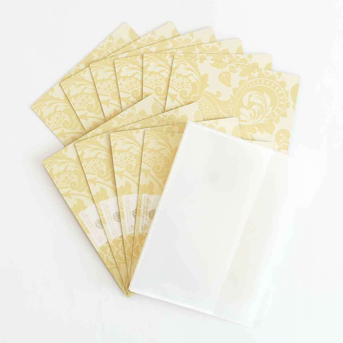 a set of five cards with a white envelope.