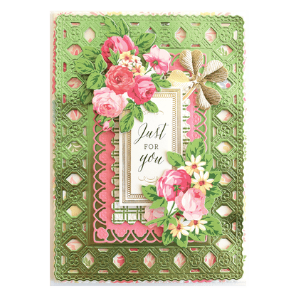 a card with pink flowers and a green border.