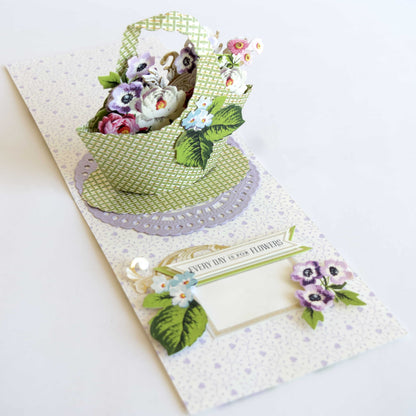 a close up of a small card with flowers on it.