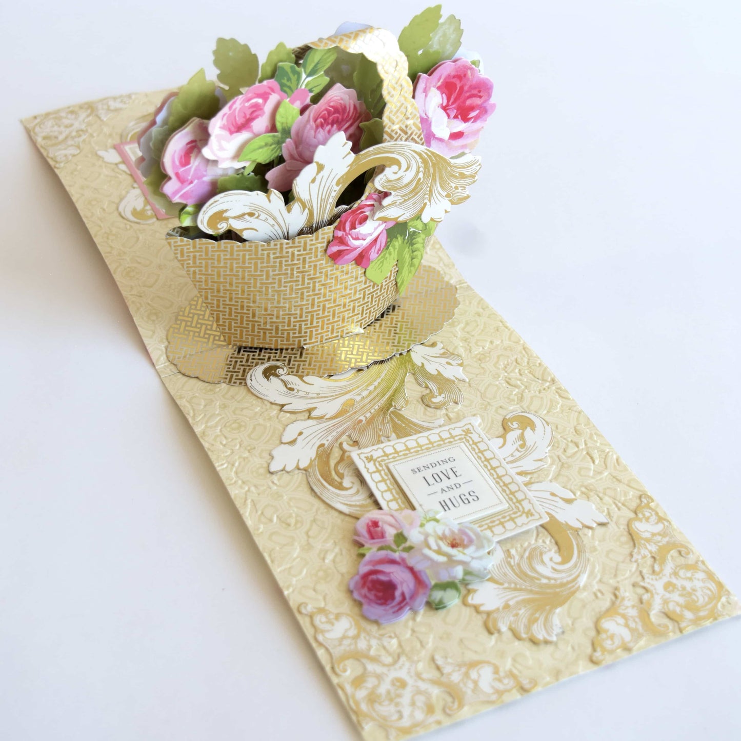 a bouquet of flowers sitting on top of a card.