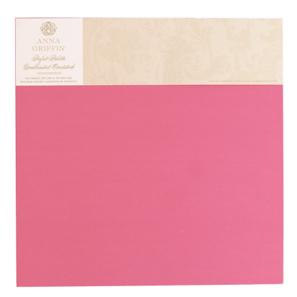 a pink and beige paper with a gold border.